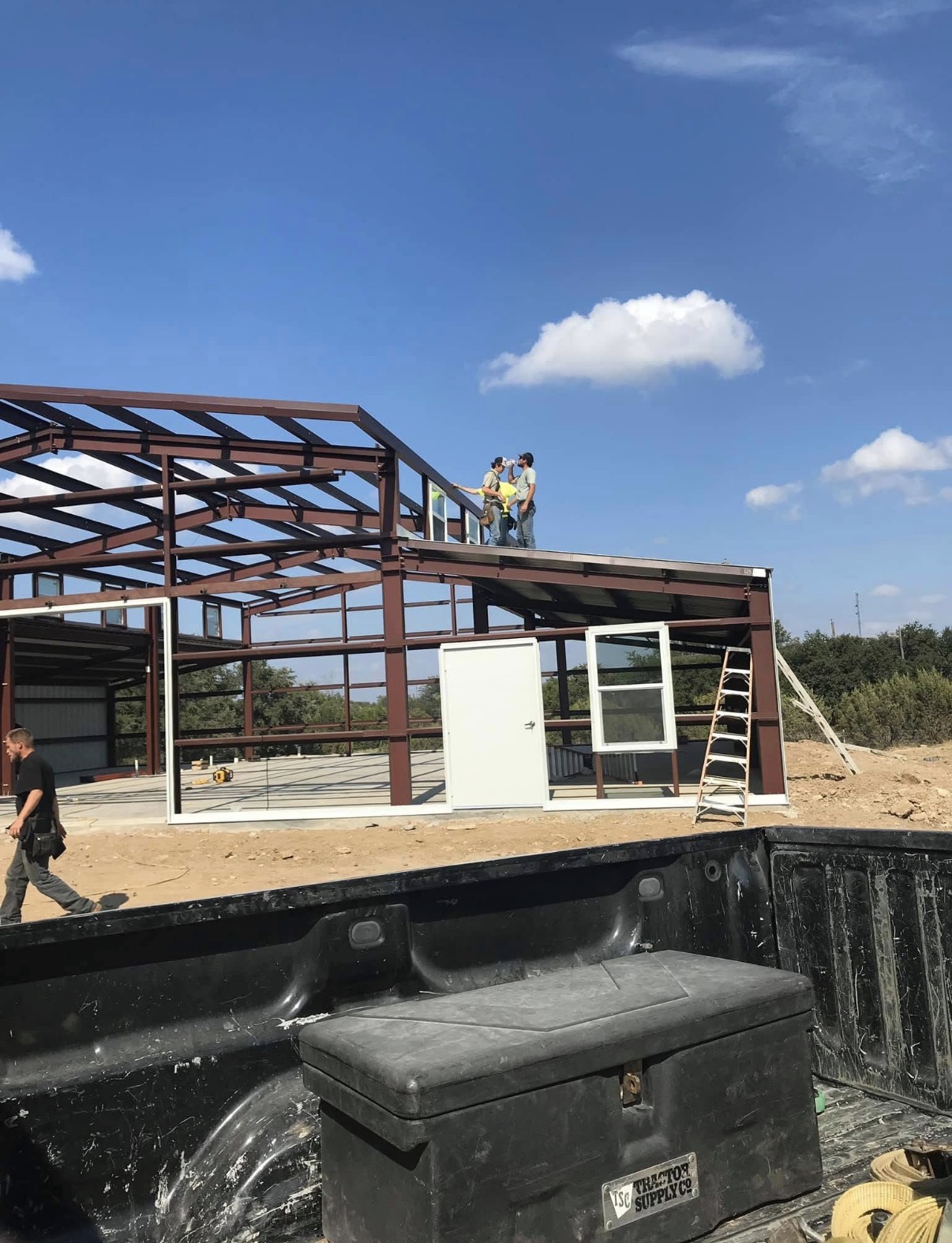 Red-iron construction with door and window openings framed in