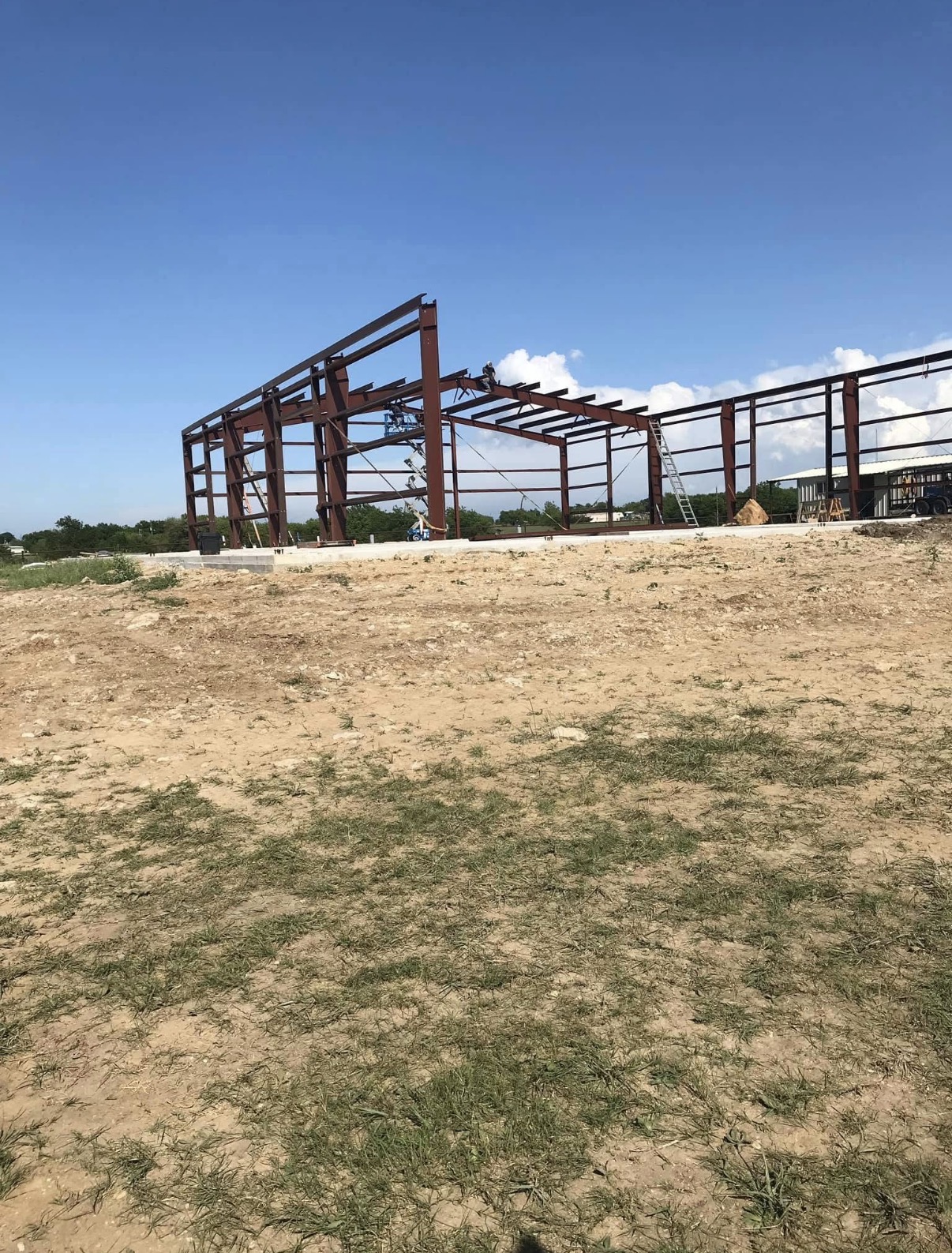 Whit-Tom red-iron building frame under construction